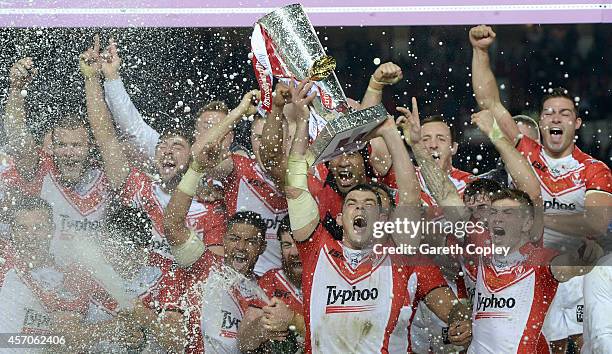 St Helens captain Paul Wellens lifts the trophy after winning the First Utility Super League Grand Final between St Helens and Wigan Warriors at Old...