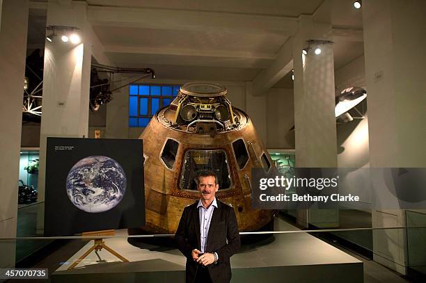 Astronaut Chris Hadfield poses for photos in front of the Apollo 10 Command Module which travelled around the Moon in 1969 on December 16, 2013 in...