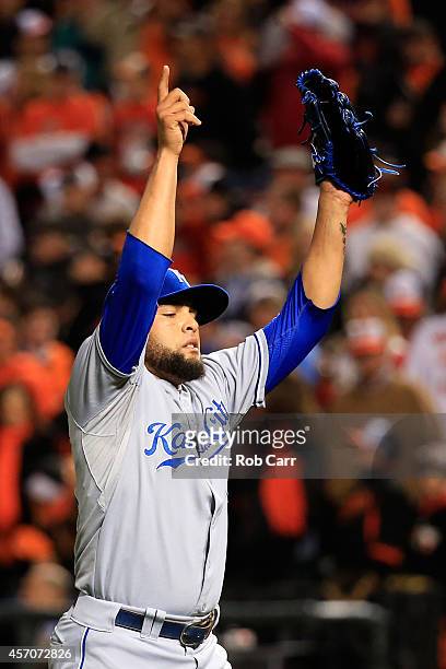 Kelvin Herrera of the Kansas City Royals celebrates at the end of the seventh inning against the Baltimore Orioles during Game Two of the American...