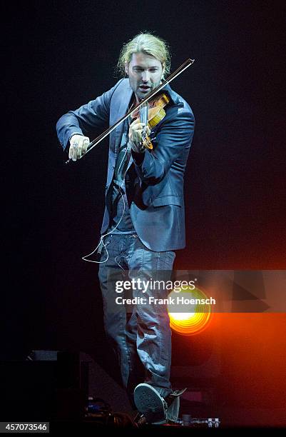 German violinist David Garrett performs live during a concert at the O2 World on October 11, 2014 in Berlin, Germany.