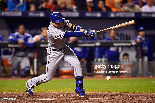 Omar Infante of the Kansas City Royals hits a single in the ninth inning against Darren O'Day of the Baltimore Orioles during Game Two of the...