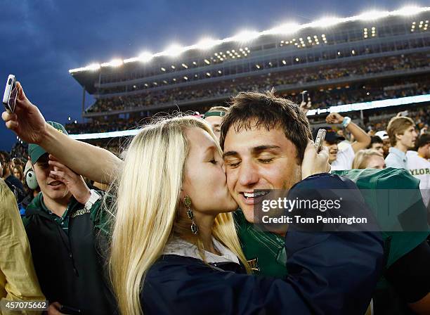 Chris Callahan of the Baylor Bears celebrates with Grace Dille after kicking the game winning field goal against the TCU Horned Frogs to win 61-58 at...
