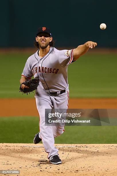 Madison Bumgarner of the San Francisco Giants pitches in the first inning against the St. Louis Cardinals during Game One of the National League...