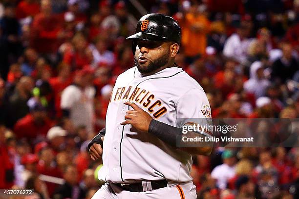 Pablo Sandoval of the San Francisco Giants runs home to score on an RBI single by Travis Ishikawa in the second inning against the St. Louis...