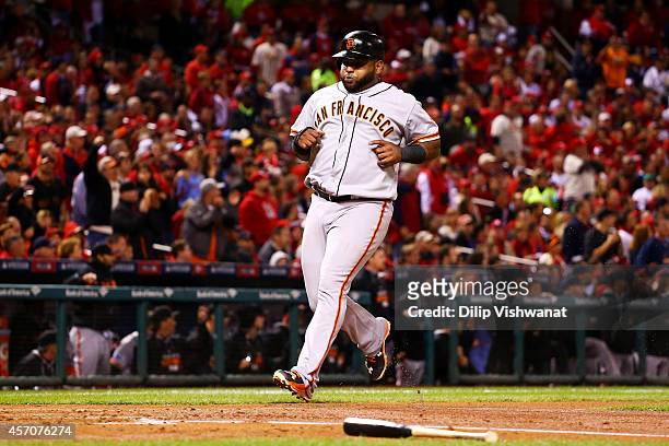 Pablo Sandoval of the San Francisco Giants runs home to score on an RBI single by Travis Ishikawa in the second inning against the St. Louis...