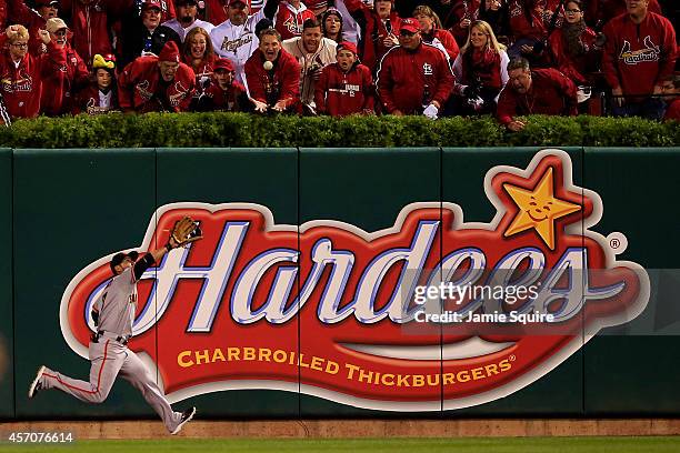 Gregor Blanco of the San Francisco Giants fields a ball for an out in the first inning against the St. Louis Cardinals during Game One of the...