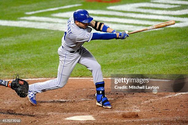 Omar Infante of the Kansas City Royals hits a single in the ninth inning against Darren O'Day of the Baltimore Orioles during Game Two of the...