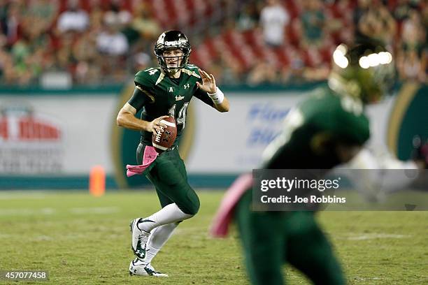 Mike White of the South Florida Bulls looks to pass the ball in the first half of the game against the East Carolina Pirates at Raymond James Stadium...