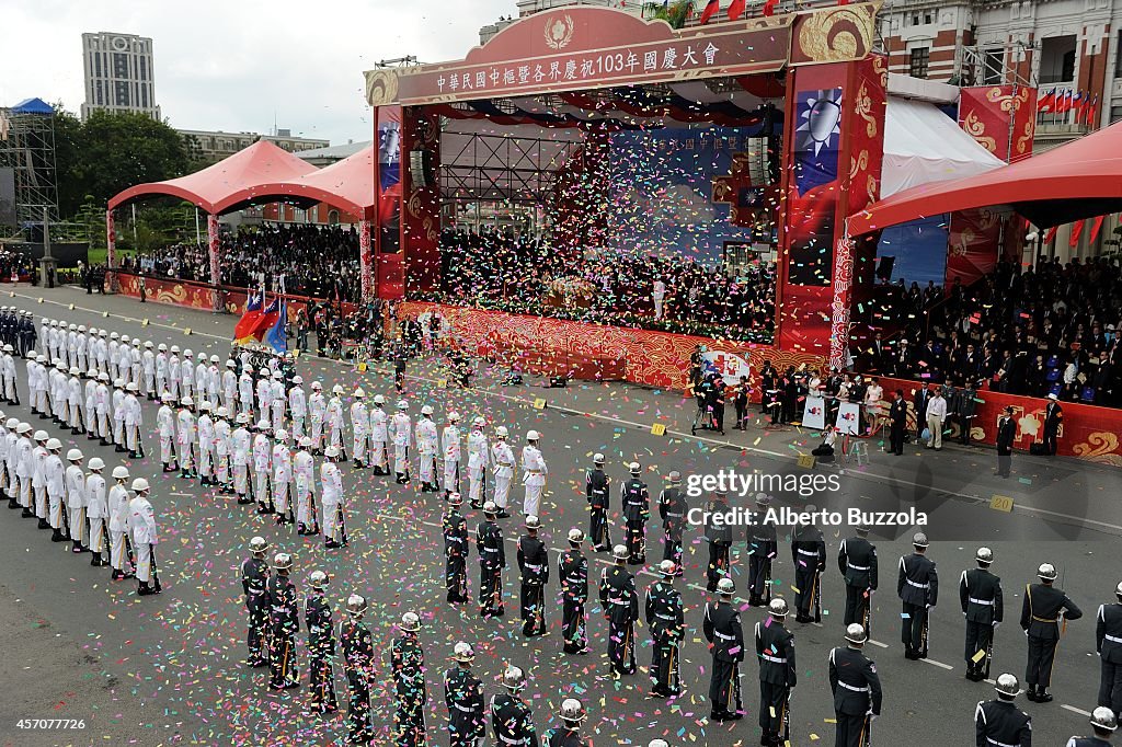 Confetti is released over the military parade in front of...