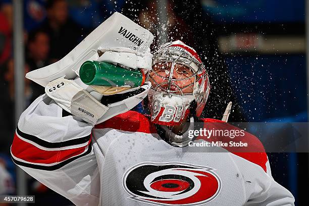 Anton Khudobin of the Carolina Hurricanes takes a break during a stoppage of play durring a game against the New York Islanders at Nassau Veterans...