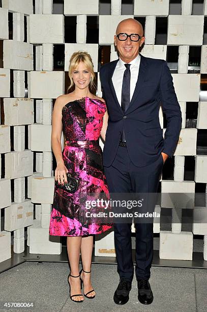 Actress January Jones, wearing Early Fall 2014 Nero Rosa Shock Silk Jacquard Laminated Dress and Knot, and Bottega Veneta, CEO, Marco Bizzarri attend...