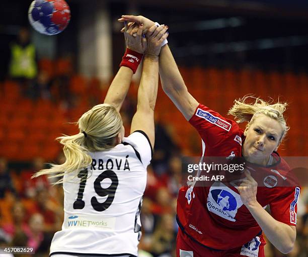 Norway's Mari Molid challenges Czech Republic's Helena Sterbova during the 2013 Women's Handball World Championship round of sixteen match between...