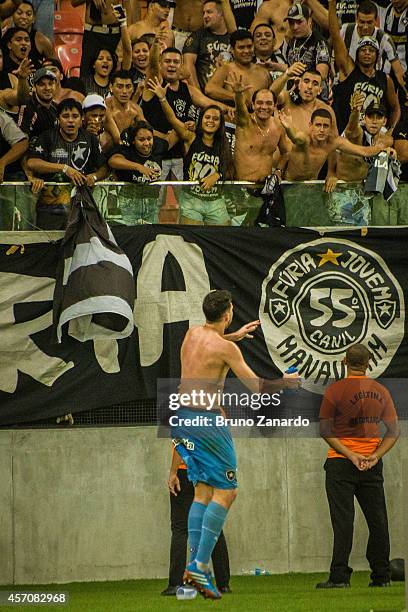 Helton Milk of Botafogo throw his uniform to the fans and celebrates his victory against Corinthians team during the Brasileirao Series A 2014 match...