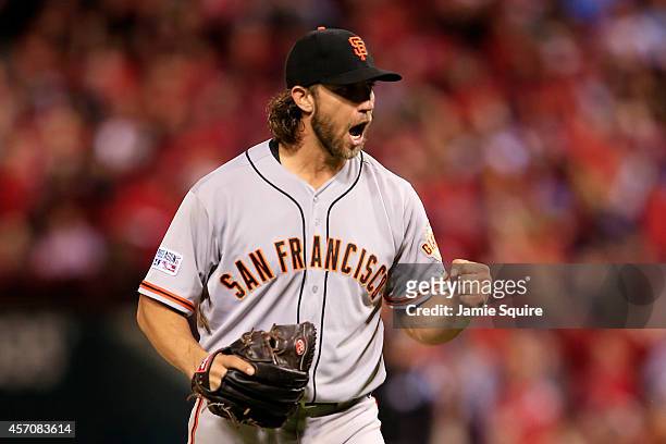 Madison Bumgarner of the San Francisco Giants celebrates the final out of the seventh inning against the St. Louis Cardinals during Game One of the...