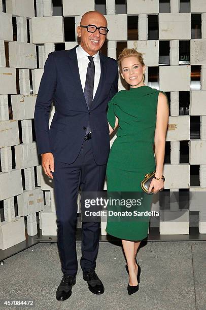 Actress Elizabeth Banks, wearing Fall-Winter 2014/2015 Emerald Green Dress, Nero Oro Gilded Waxed Leather Knot and Nero Suede Pump wearing...