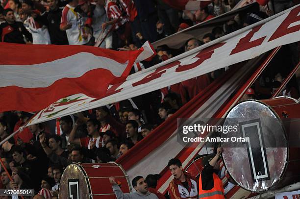 Fans of Estudiantes cheer for their team during a match between Estudiantes and Racing Club as part of Torneo de Transicion 2014 at Ciudad de la...