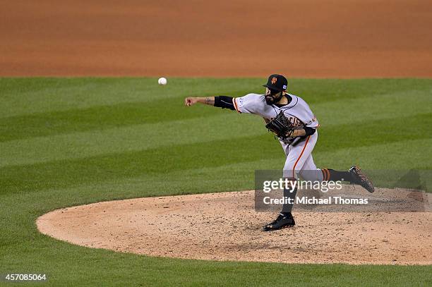 Sergio Romo of the San Francisco Giants pitches in the eighth inning against the St. Louis Cardinals during Game One of the National League...