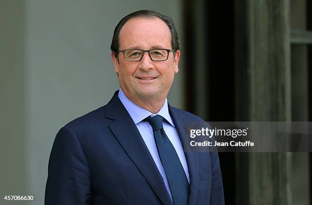 French President Francois Hollande receives Arnold Schwarzenegger to talk about climate change at Elysee Palace on October 10, 2014 in Paris, France.