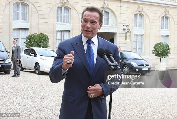 French President Francois Hollande receives Arnold Schwarzenegger to talk about climate change at Elysee Palace on October 10, 2014 in Paris, France.