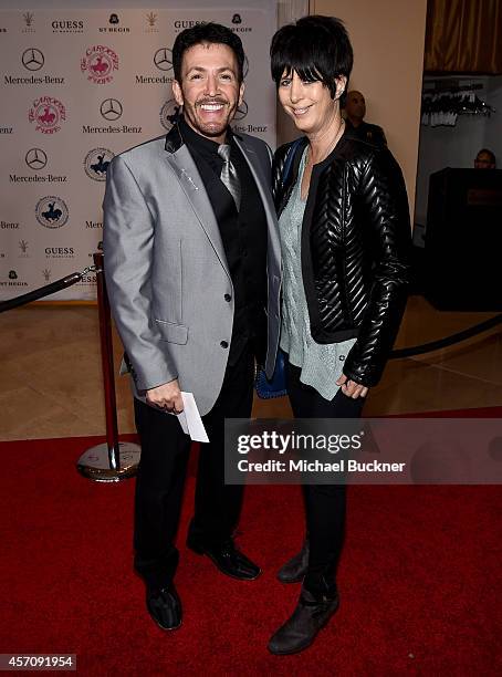 Vocal coach Eric Vetro and songwriter Diane Warren attends the 2014 Carousel of Hope Ball presented by Mercedes-Benz at The Beverly Hilton Hotel on...