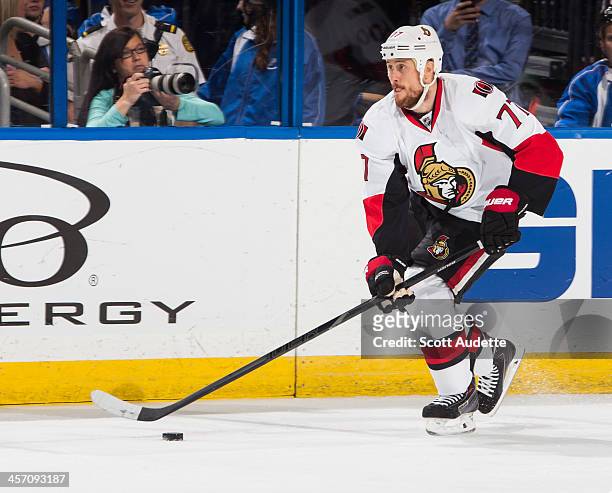 Joe Corvo of the Ottawa Senators carries the puck against the Tampa Bay Lightning at the Tampa Bay Times Forum on December 5, 2013 in Tampa, Florida.