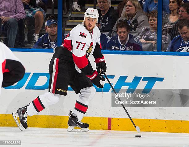 Joe Corvo of the Ottawa Senators carries the puck against the Tampa Bay Lightning at the Tampa Bay Times Forum on December 5, 2013 in Tampa, Florida.