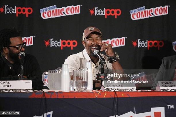 Carl Jones, Michael Jai White speak at The Adult Swim Black Dynamite panel during Adult Swim at New York Comic Con 2014 at Jacob Javitz Center on...