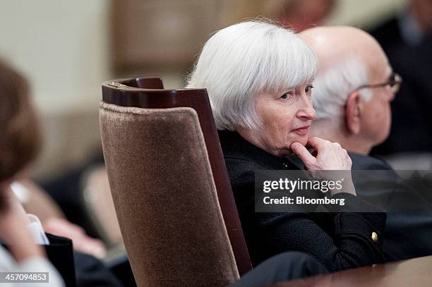 Janet Yellen, vice chairman of the U.S. Federal Reserve, center, and Paul Volcker, former Fed chairman, right, attend an event commemorating the...