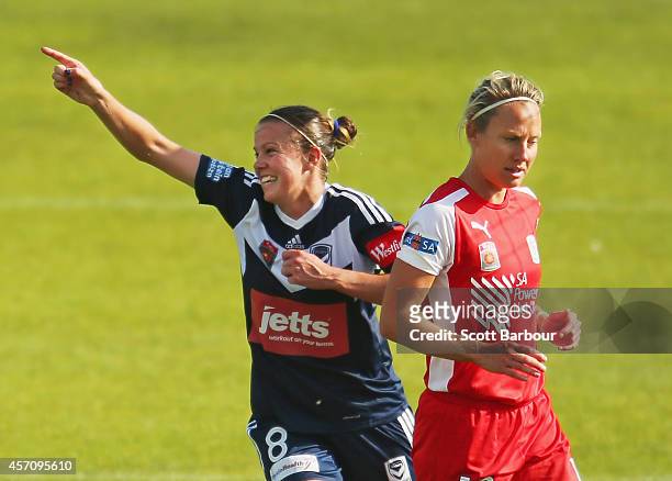 Amy Jackson of Melbourne celebrates after scoring a goal as Katie Holtham of Adelaide looks on during the round five W-League match between Melbourne...