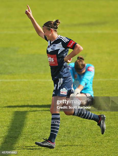 Amy Jackson of Melbourne celebrates after beating Adelaide goalkeeper Melissa Barbieri to score her third goal during the round five W-League match...