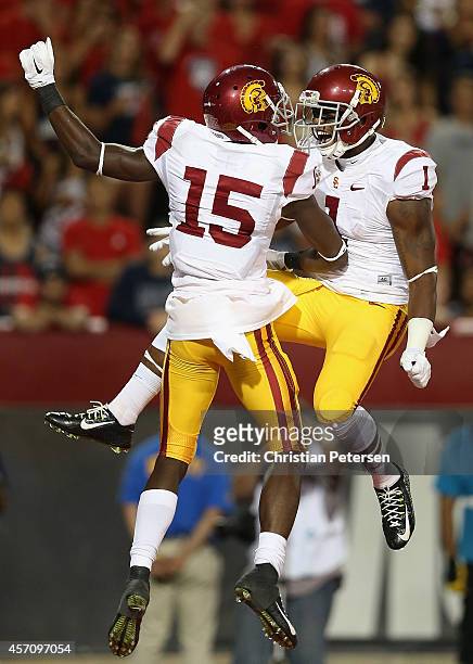 Wide receivers Nelson Agholor and Darreus Rogers of the USC Trojans celebrate after Agholor scored a 21 yard touchdown reception against the Arizona...