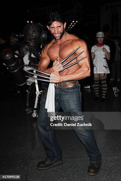 Comic Con attendee poses as Wolverine during the 2014 New York Comic Con at Jacob Javitz Center on October 11, 2014 in New York City.