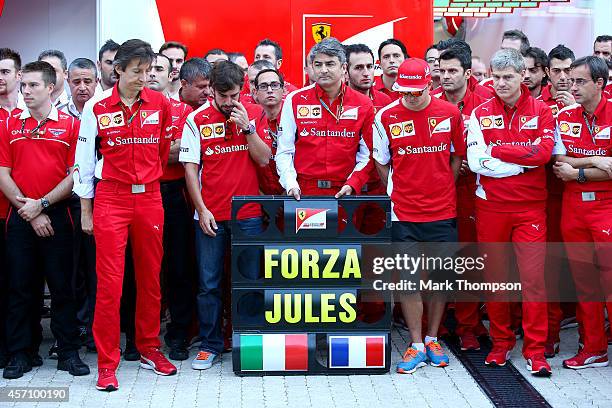 Members of the Ferrari and Marussia teams, including Fernando Alonso, Kimi Raikkonen and Ferrari Team Principal Marco Mattiacci, pay tribute to Jules...
