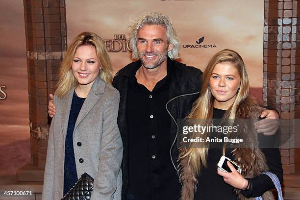 Robert Dekeyser and daughter Carolin and guest attend the "The Physician" German premiere at Zoo Palast on December 16, 2013 in Berlin, Germany.