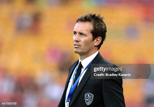 Coach Mike Mulvey of the Roar watches on during the round one A-League match between the Brisbane Roar and Adelaide United at Suncorp Stadium on...