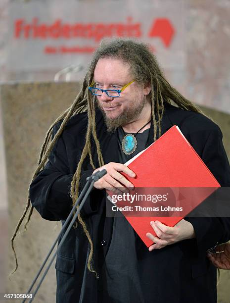 Jaron Lanier receives his award during the ceremony at Paulskirche on October 12, 2014 in Frankfurt am Main, Germany. American born computer...