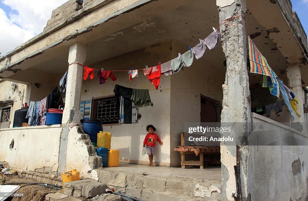 Palestinians live in the ruins of a destroyed Gaza's Shujaya neighborhood