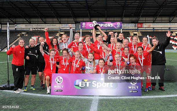 The Liverpool Ladies team celebrate with the WSL trophy up after their sides victory during the FA WSL 1 match between Liverpool Ladies FC and...