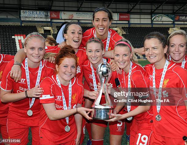 Gemma Bonner of Liverpool Ladies FC celebrates with her team-mates and the WSL trophy up after her sides victory during the FA WSL 1 match between...