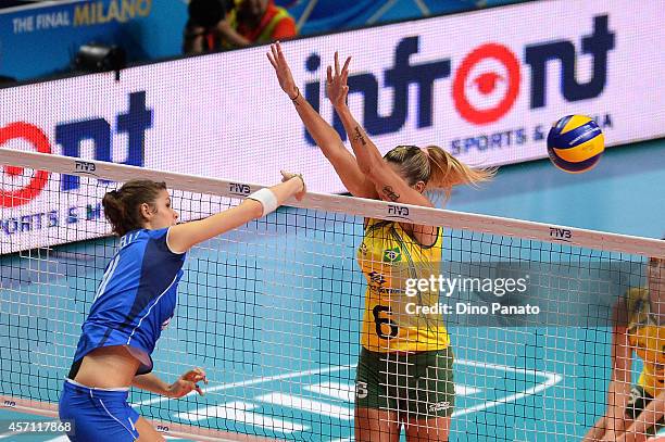 Cristina Chirichella of Italy spikes the ball against to Thaisa Menezes of Brazil during the FIVB Women's World Championship 3rd Place Playoff match...