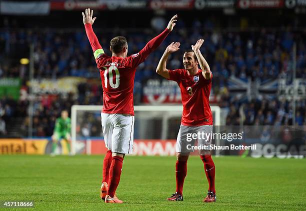 Wayne Rooney of England celebrates with teammate Leighton Baines after scoring the opening goal from a free kick during the EURO 2016 Qualifier match...