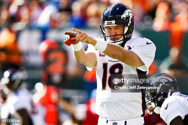 Peyton Manning of the Denver Broncos yells to teammates in the second quarter during a game against the New York Jets at MetLife Stadium on October...