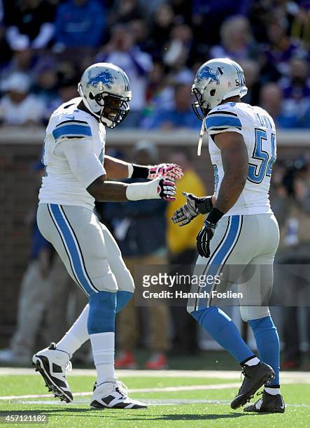 Ezekiel Ansah and DeAndre Levy of the Detroit Lions celebrate a sack of Teddy Bridgewater of the Minnesota Vikings during the second quarter of the...