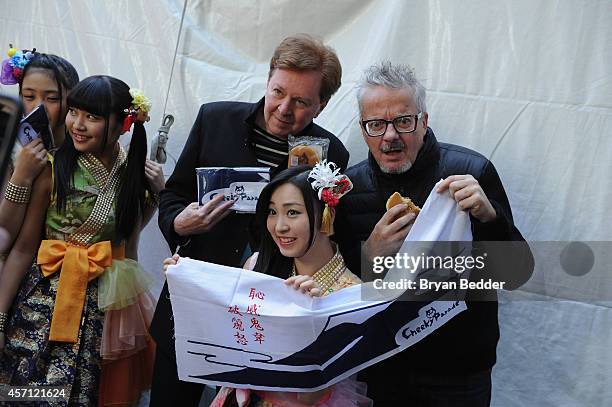 Members of the band Devo Gerald Casale and Mark Mothersbaugh pose backstage with Cheeky Parade during CBGB Music & Film Festival 2014 - Times Square...