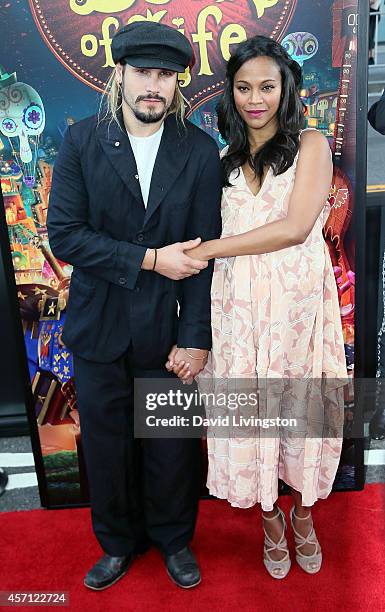 Actress Zoe Saldana and husband Marco Perego attend the premiere of Twentieth Century Fox and Reel FX Animation Studios' "The Book of Life" at Regal...