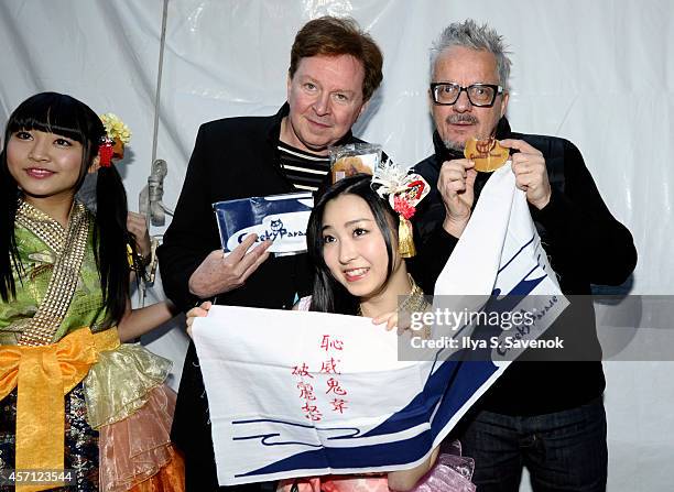 Members of the band Devo Gerald Casale and Mark Mothersbaugh pose backstage with Cheeky Parade during CBGB Music & Film Festival 2014 - Times Square...