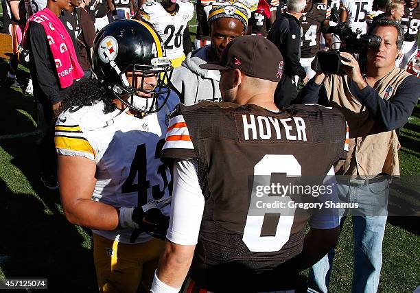 Brian Hoyer of the Cleveland Browns is greeted by Troy Polamalu of the Pittsburgh Steelers after Cleveland's 31-10 win at FirstEnergy Stadium on...