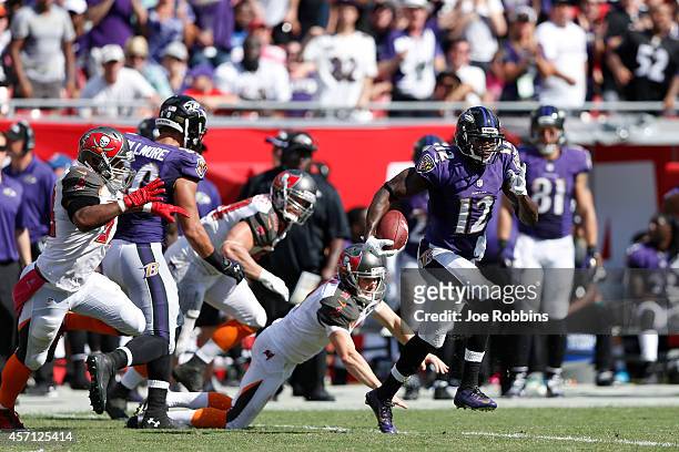 Jacoby Jones of the Baltimore Ravens returns a kickoff 58 yards in the third quarter of the game against the Tampa Bay Buccaneers at Raymond James...
