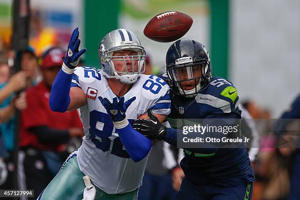 Tight end Jason Witten of the Dallas Cowboys misses a catch against linebacker Malcolm Smith of the Seattle Seahawks at CenturyLink Field on October...