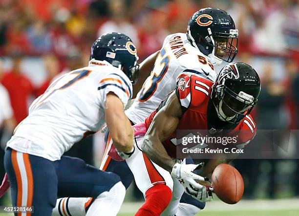 Julio Jones of the Atlanta Falcons fails to pull in this reception against Darryl Sharpton and Chris Conte of the Chicago Bears at Georgia Dome on...